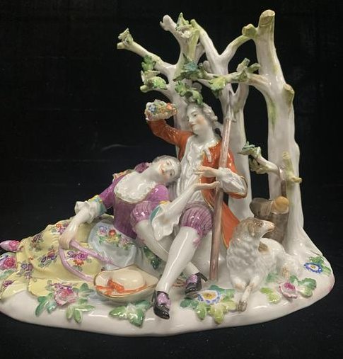 Antique Meissen Porcelain Group of People and Tree: Antique Meissen porcelain group of man and woman laying against a tree.