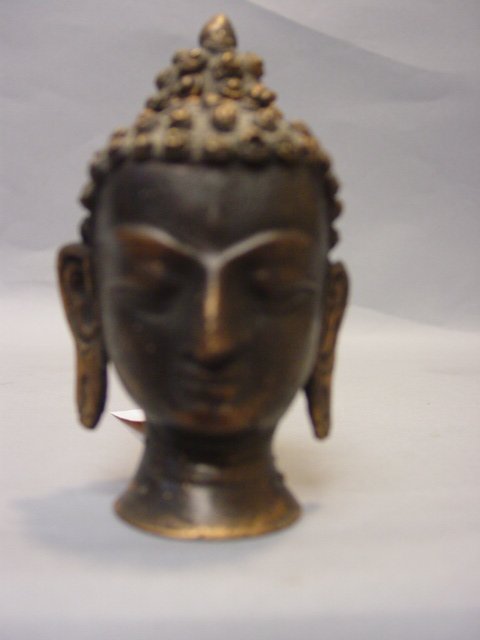 Thai Bronze Antique Buddha: Thai Bronze Antique Buddha has a deep and Dark Patina with signs of wear and use. Measures 4 1/2"