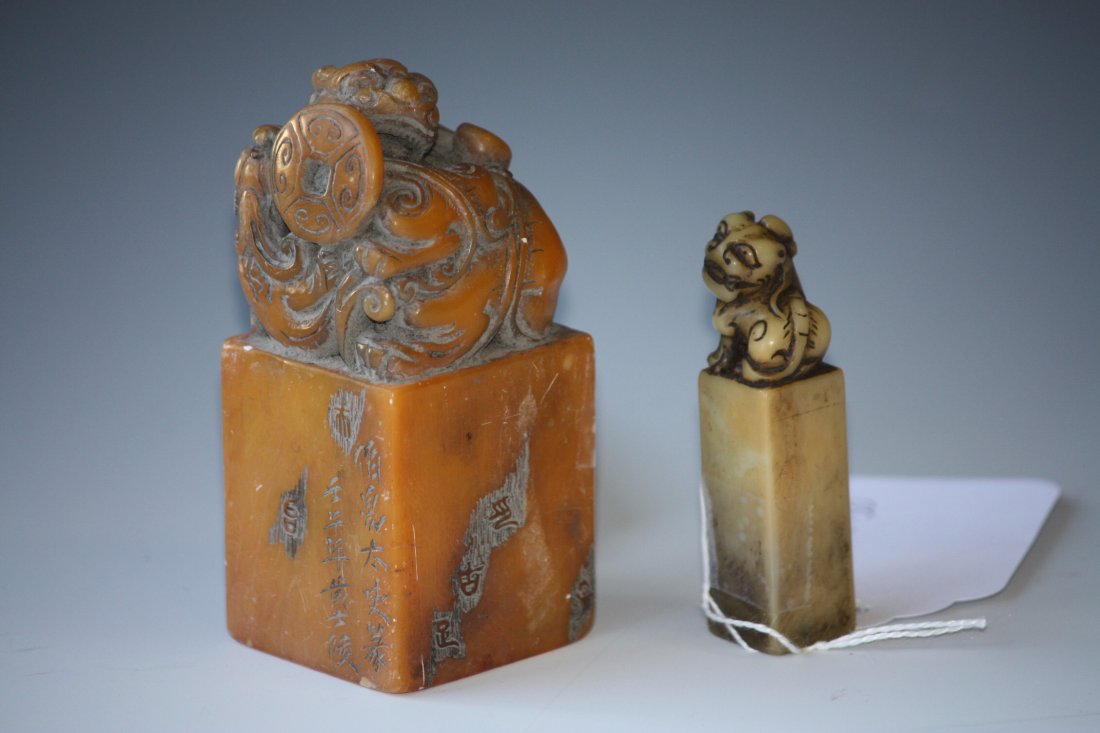 Two Foo Lion Seals of Chinese Soapstone: Two Foo Lion Seals of Chinese Soapstone, Each depicting a Foo Lion at the Top of the Seal and the Larger also Has Money and Poetic Carvings all around. H: 3.5 Inches (taller)