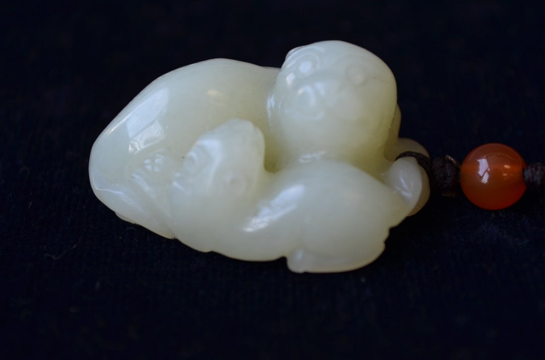 Chinese Carved White Jade Toggle of a Foo Dog & Pu: Chinese Carved White Jade toggle of a Foo Dog & Puppy L: 1.75 Inches