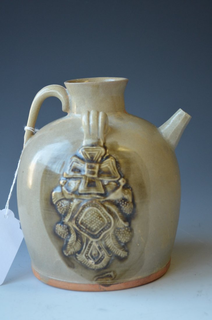 Chinese Celedon Glazed Flat Bottom Ewer: Chinese Celedon Glazed Flat Bottom Ewer, Both sides of which are embellished with Buddhist emblems overglazed with dark green glaze H: 7 Inches