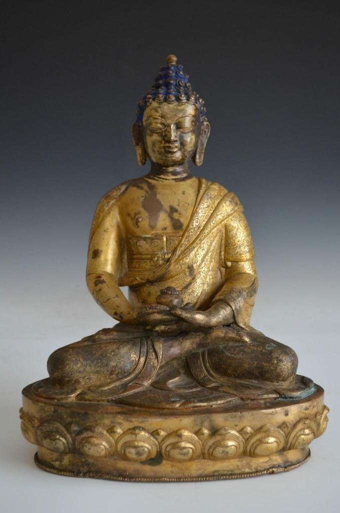 Incised Floral Buddhist Pattern Bronze Gilt Buddha: All over incised Floral Buddhist Pattern Bronze Gilt Buddha Seated on a Lotus Pedestal and with Traces of Paint, Base has incised Lotus Mark,H: 9 Inchese