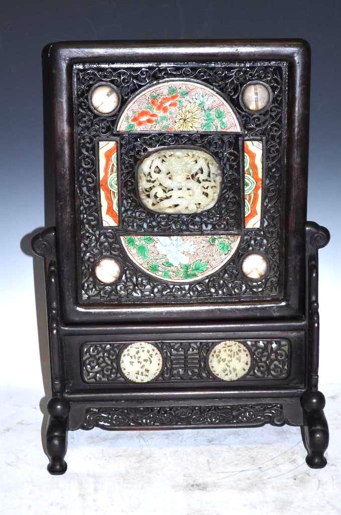 Ming Dnasty Carved White Jade & Porcelain Table Screen: Chinese Hardwood Table Screen with Ming Dynasty Inserts of White Jade and Painted Porcelain Well-carved hardwood Chinese table screen with jade medallion, floral-painted inserts and other decorative e