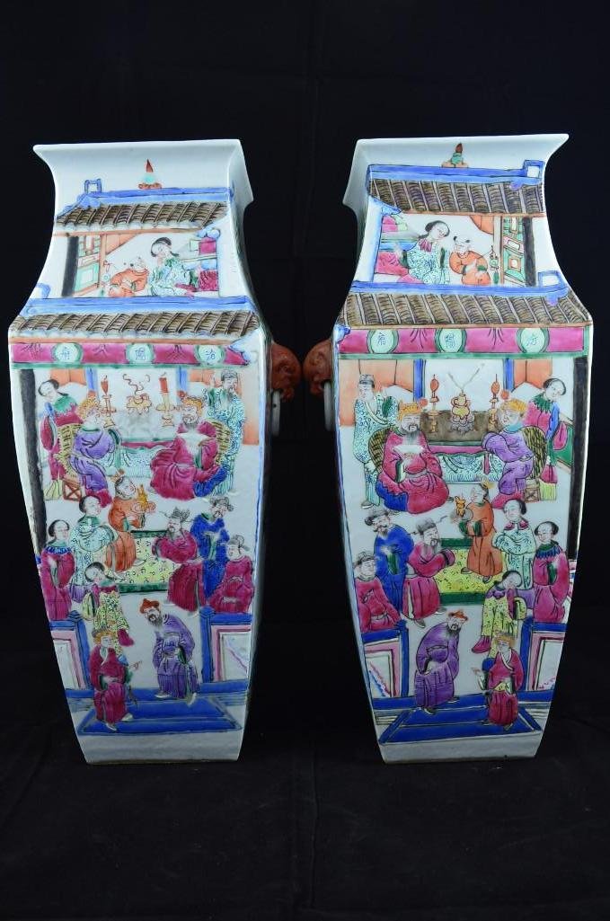 Pair of Famille Rose Square Vase with Foo Lion Mask Han: Pair of Famille Rose Square Vase with Foo Lion Mask Handles each side is vividly enamel painted with various scenes depicting Ladies & Noblemen in Court Meetings. H: 15 1/2 Inches
