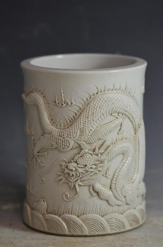 Chinese White Dragon Porcelain Brush Pot: Chinese White Dragon Porcelain Brush Pot with deep makrs seal mark in base. H: 8 Inches