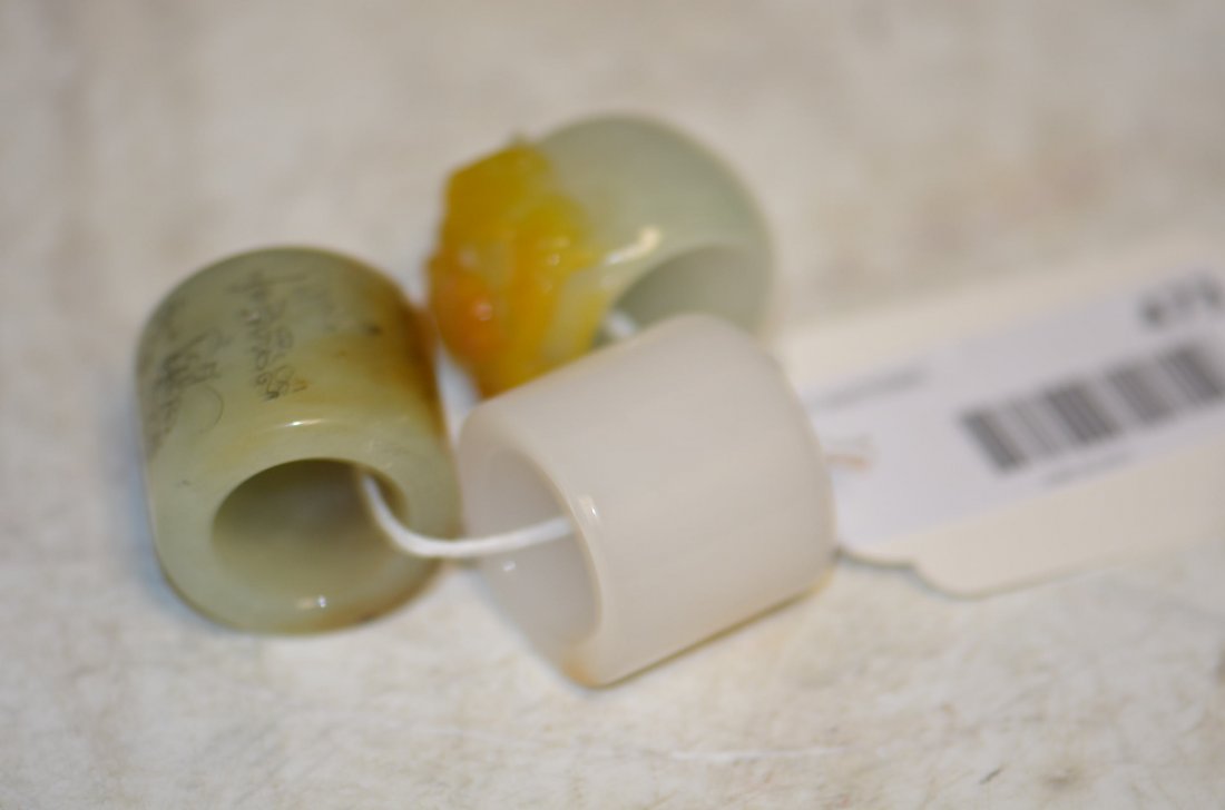 Three Various Carved Jade Chinese Archers Rings: Three Various Carved Jade Chinese Archers Rings, Expertly Carved from Various Kinds and Colors of Jade; H: 1.25 Inches