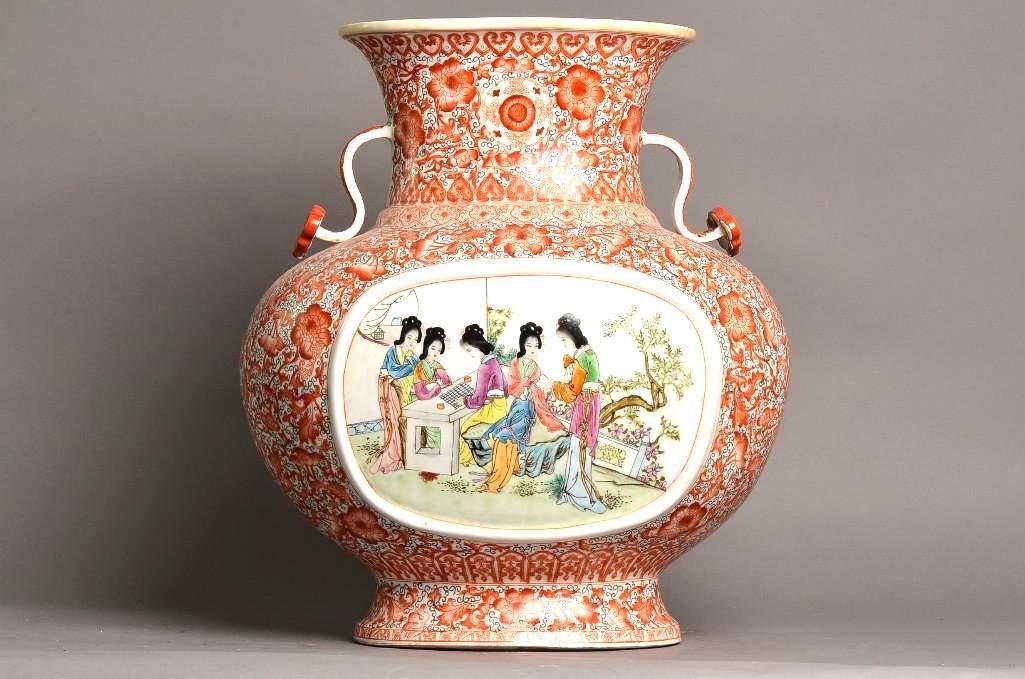 Large Porcelain Famille Rose Vase: Large Qing Dynasty Porcelain Famille Rose Vase Painted With Coral Colored Floral Ground and Central Panel of Women in a Garden with Ruyi Scepter Handles with seal mark of the Qianlong period; H: 17.5 