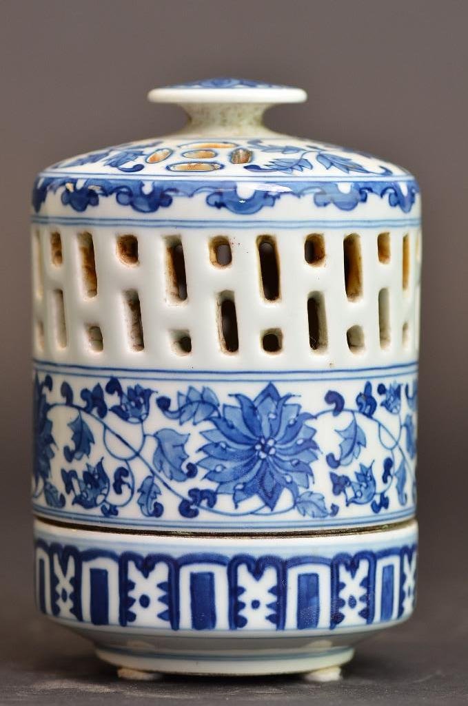 Antique Chinese Blue and White Porcelain Cricket Jar: Antique Chinese Blue and White Porcelain Cricket Jar intricately painted with floral motif and pierced with a geometric pattern; H: 5.25 Inches