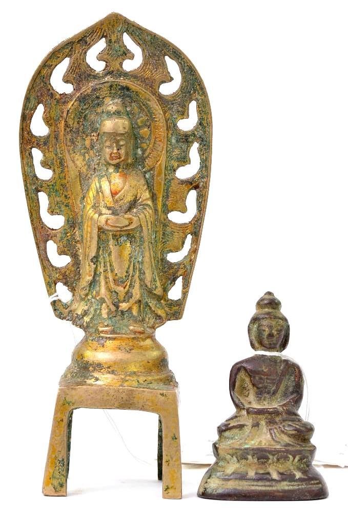 Two Antique Buddhist Devotional Objects of the Buddha: Two Antique Buddhist Devotional Objects, one seated Buddha on a lotus flower and one standing Buddha with Holy surround; H: 7.75 Inches
