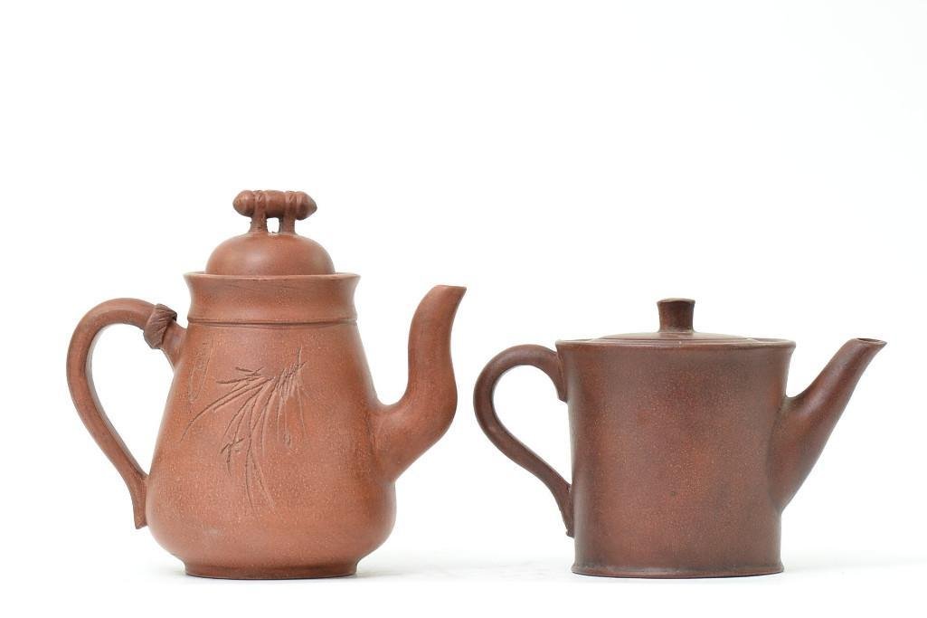 Two Antique Chinese Red Clay Yixing Pottery Teapots: Two Antique Chinese Red Clay Yixing Pottery Teapots, with seal marks; H: 6.5 Inches