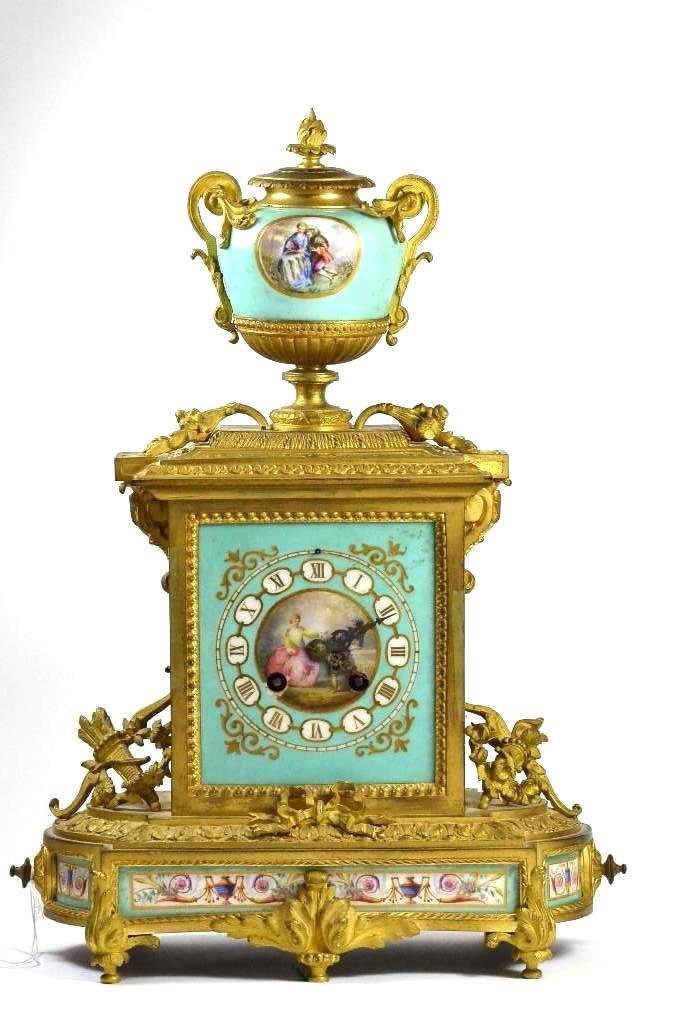 Antique French Bronze and Procelain Mantle Clock: Antique French Louis Seize Style Ormolu Gilt Bronze and Pale Green Ground Porcelain Mantle Clock very detailed bronze work, porcelain clock face uses Roman Numerals and has a cnetral medallion depicti