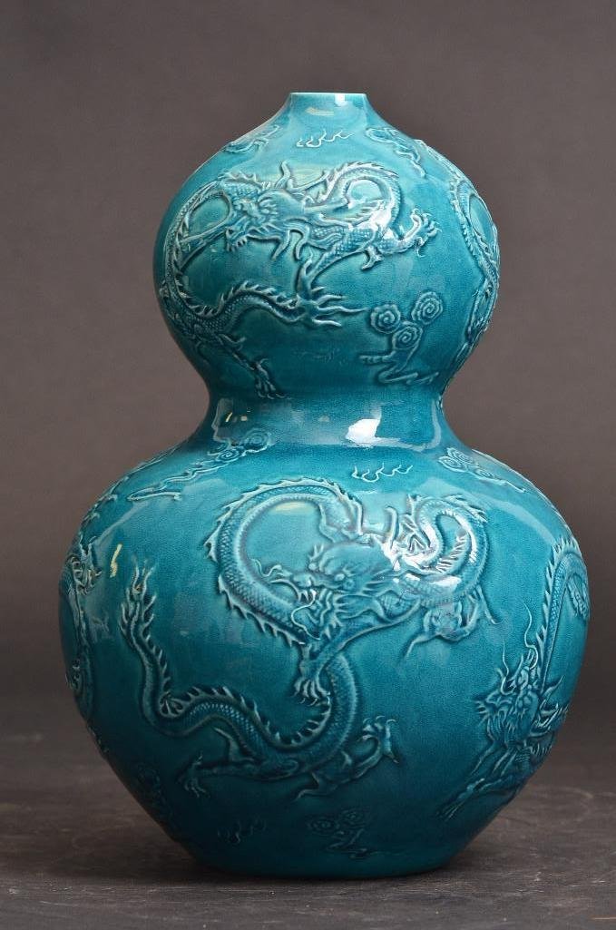 Antique Chinese Turqouise Glaze Double Gourd Vase: Antique Chinese Turqouise Glaze Porcelain Double Gourd Vase incised with dragons flying in a sky of ruyi scepter shaped clouds circling a pearl with seal mark to base; H: 10 Inches