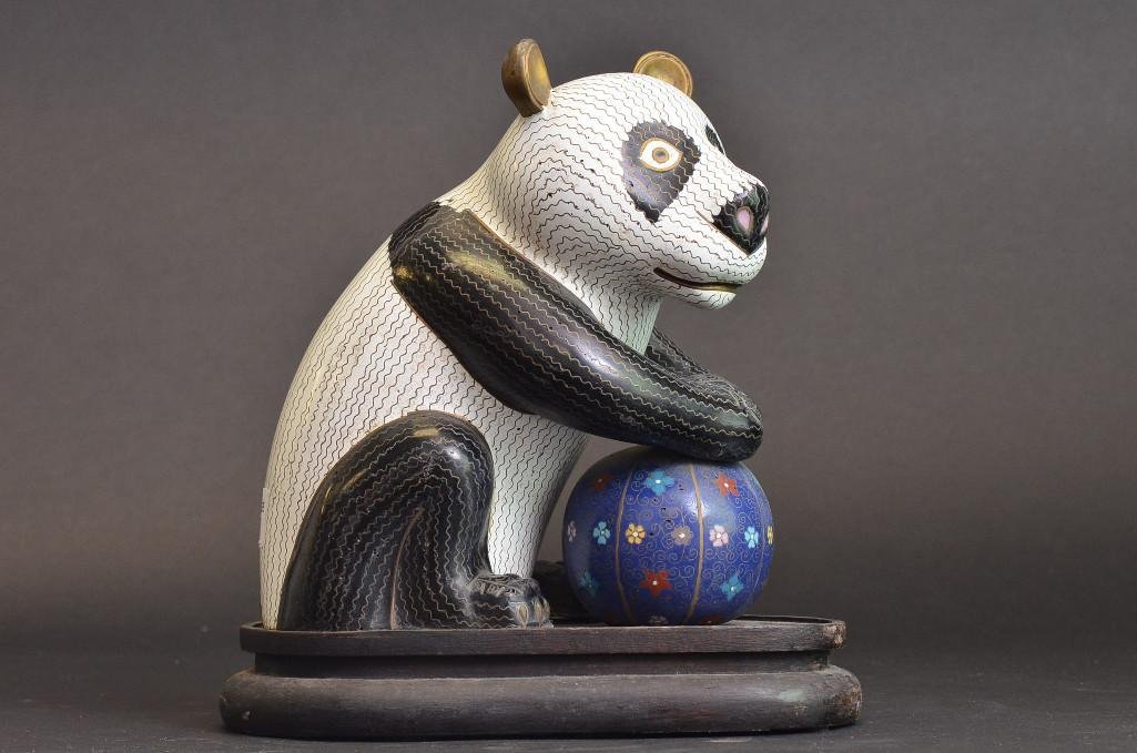 Antique Chinese Cloisonne Panda Bear on Base: Antique Chinese Cloisonne Panda Bear on Base enamel on bronze in the shape of a Chinese Panda Bear holding a brightly colored ball that can spin around; H: 12.5 Inches