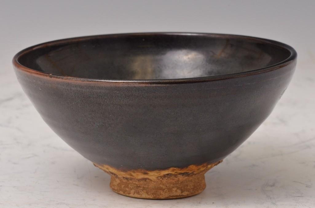 Antique Chinese Black Glaze Earthenware Bowl: Antique Chinese Black Glaze Earthenware Bowl, beautiful black glaze with variations in thickness on the rim and base creating beautiful shaded effect, nicely potted with bands throughout; D: 7 Inches