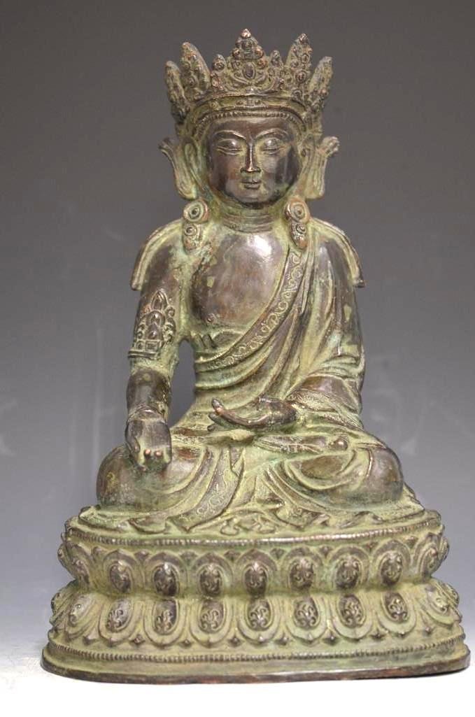Antique Ming Dynasty Bronze Figure of a Bodhisattva: Antique Ming Dynasty Bronze Figure of a Bodhisattva seated on a double lotus flower base and wearing a prominent crown, well cast with some fine details; H: 13.5 Inches