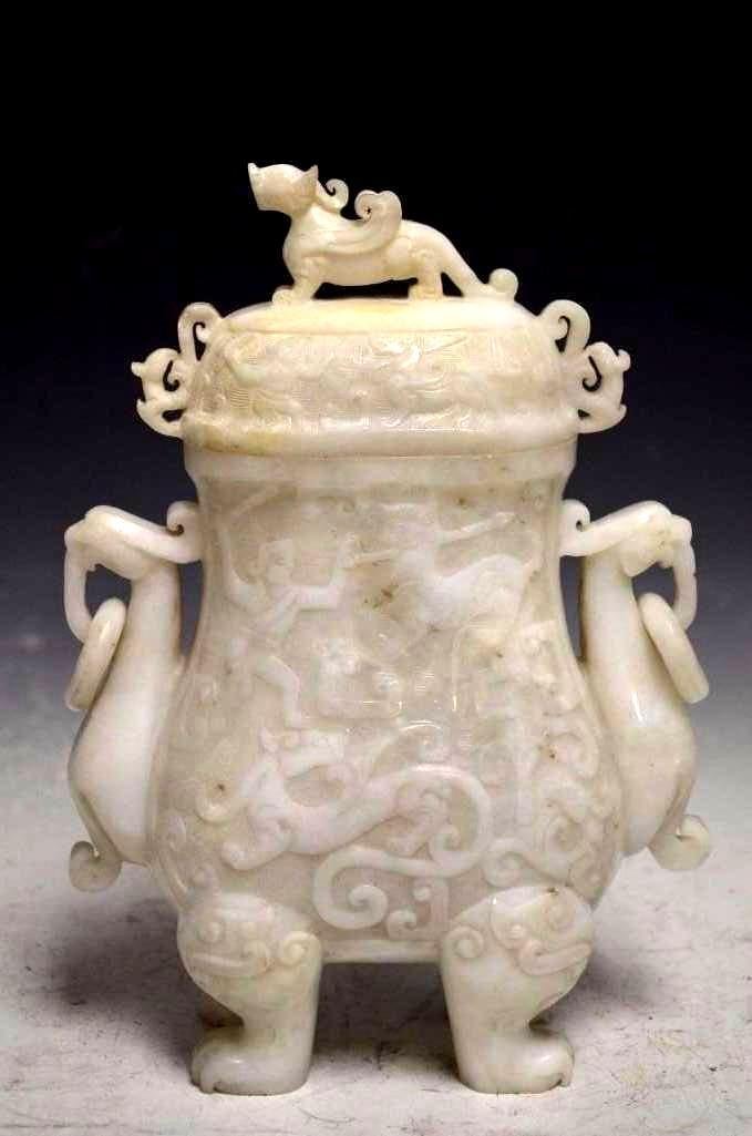 Carved White Hetian Jade Food Vessel: Carved White Hetian Jade Food Vessel. A Flattened Oval Body With Four Feet & Phoenix Handles With A Chi ling On The Lid and Various Archaic Designs In High Relief Throughout The Body & The Lid