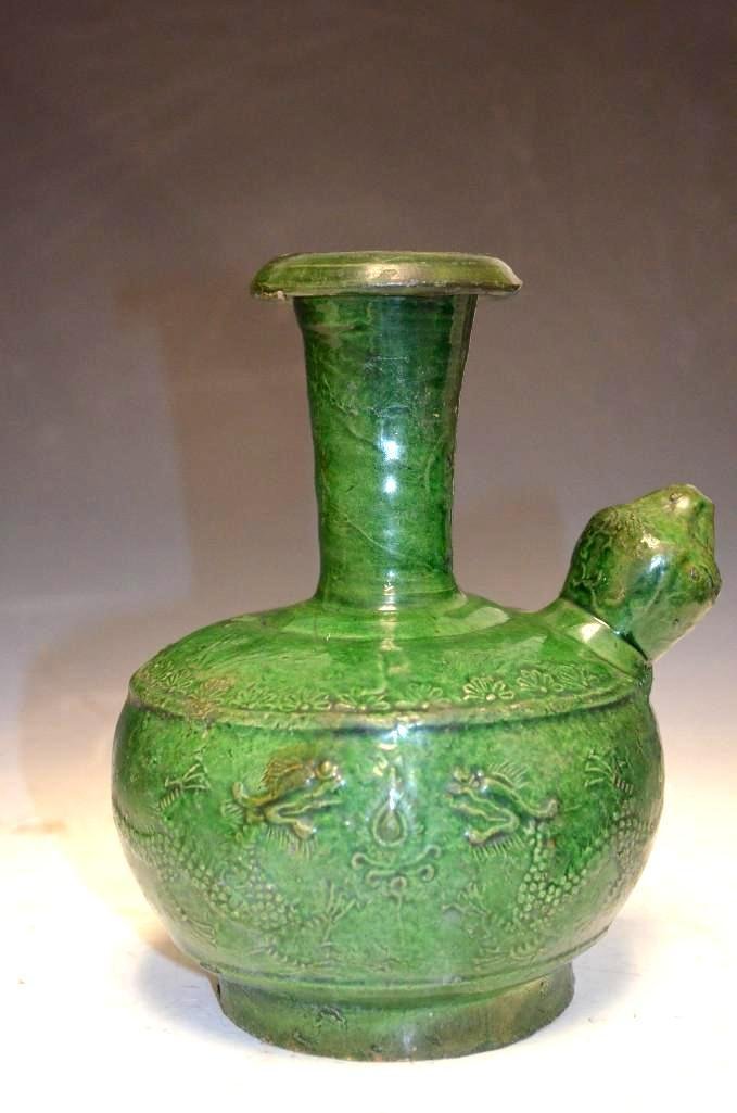 Antique Ming Dynasty Green Glaze Porcelain Kendi: Antique Ming Dynasty Green Glaze Porcelain Kendi with designs of flowers and dragons; H: 8 Inches