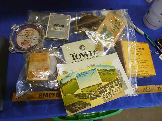 Advertising Lot: Sholes "Salesman Sampler"; Lee's: Save the Baby Ashtrays, Zippo Nascar Lighter, Smith Paint Folding rule. More