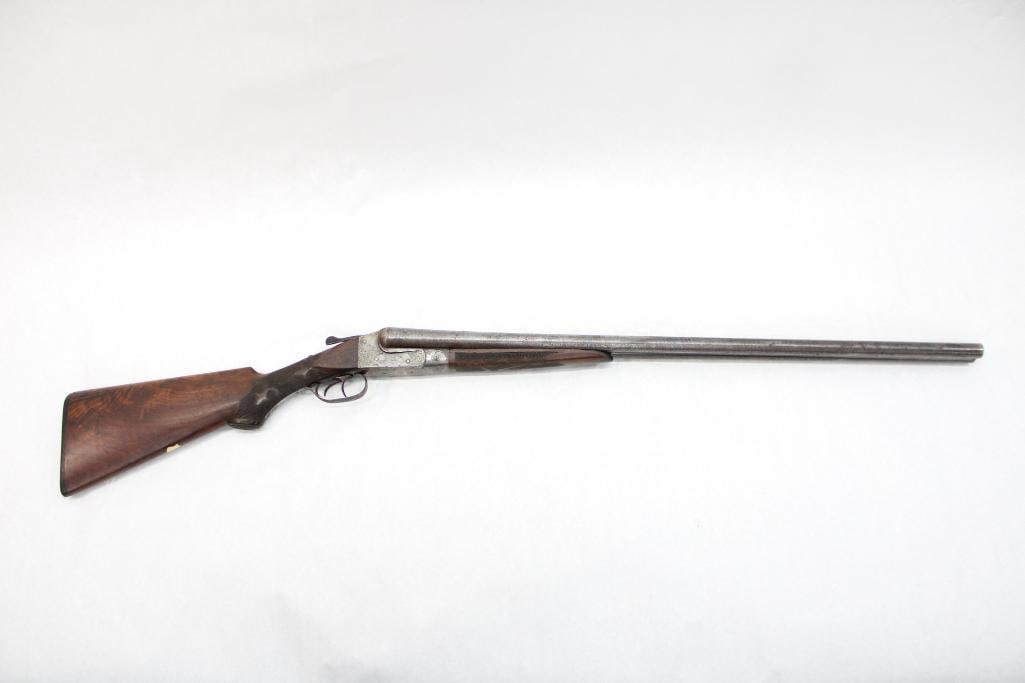 Ithaca Gun Co. Grade 4 Side by Side Shotgun: s.n. 130685, .12 Ga., 30" Damascus barrels, extractors, scroll and dog engraved action, highly figured and checkered walnut stock with Ithaca butt plate, some light rust on the barrels exteriors, shin