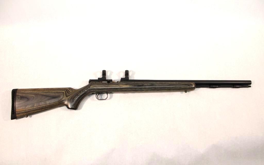 Thompson/Center Black Diamond Millenium Black Powder Rifle: s.n. 2150, .50 cal, green laminate stock, QD scope rings installed. Modern (23-0724)