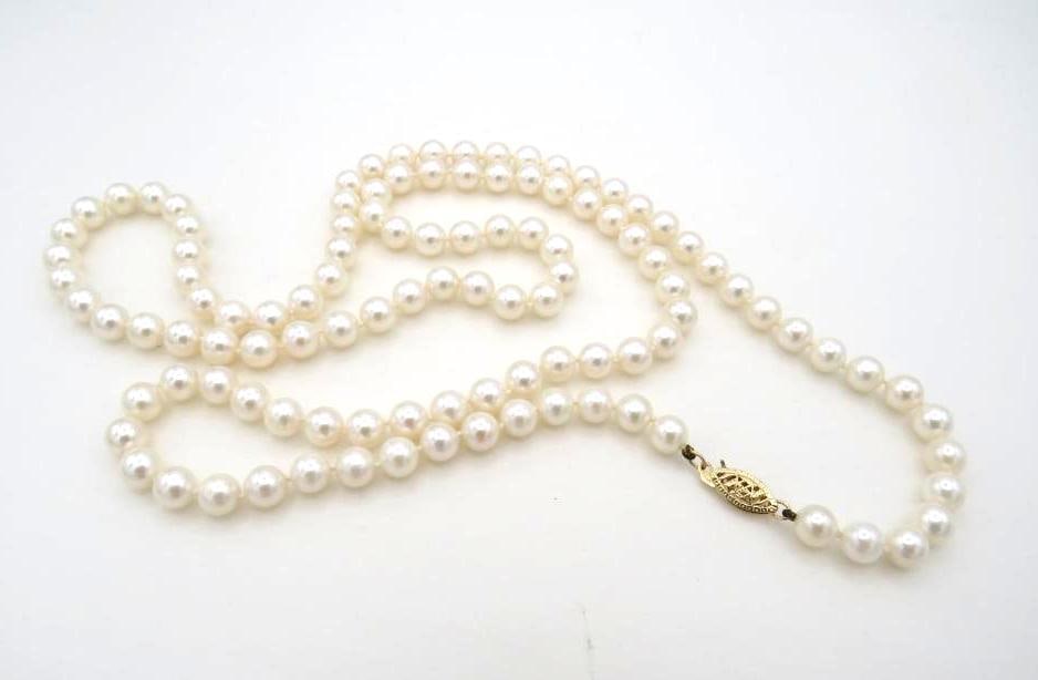 Pearl Necklace: 30" in length, (110) 6.2-6.6mm pearls, 14K gold clasp