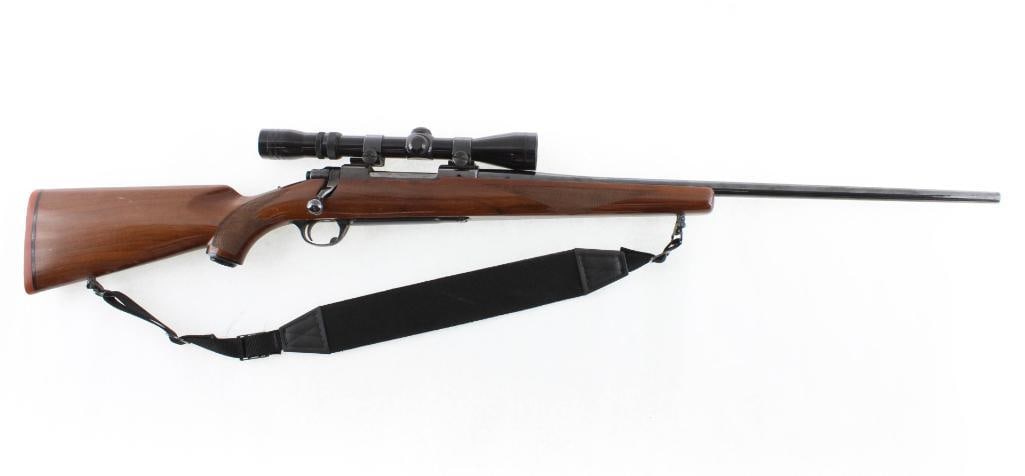 Ruger M77 Bolt Action Rifle: s.n.. 71-21087, 7mm Remington Magnum, 24" barrel, with Redfield 3-9X widefield scope. Modern (25-0060)