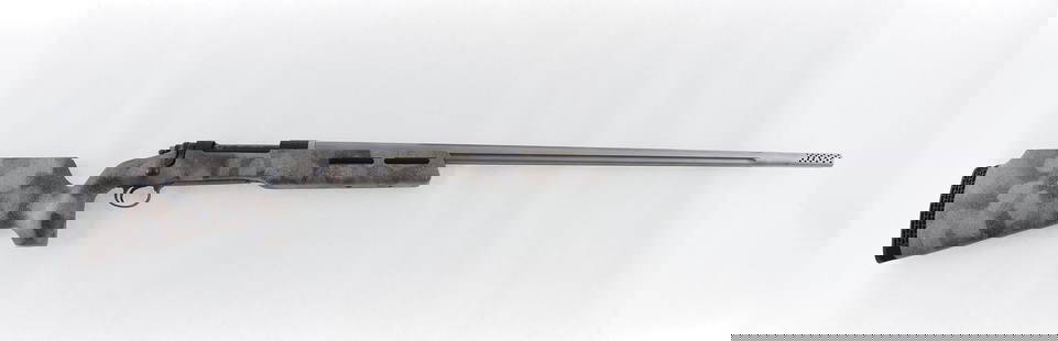 Custom Remington Model 700 Bolt Action Rifle: s.n. B6869396, .338-.378 Weatherby Magnum. This long ranger features a tapered 32" fluted and ported stainless steel barrel, synthetic camo free floating stock and is drilled and tapped for scope