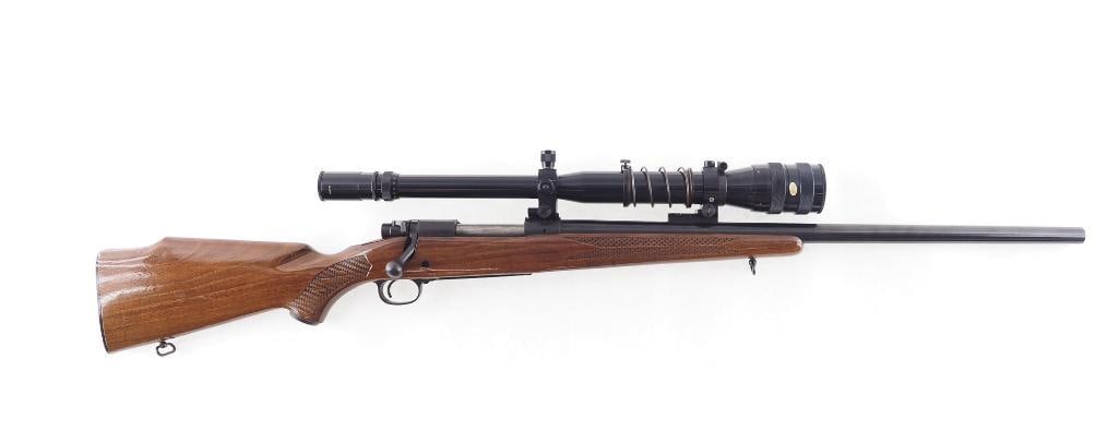 Winchester Model 70 Bolt Action Rifle: s.n. 791871, .243 Winchester. Features a heavy 24" tapered round barrel, checkered stock with red "W" grip cap and a period Tasco 6-18x40 zoom nitrogen filled scope. Ca. 1965. C&R (25-0144)