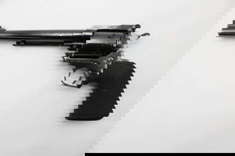 Ruger New Model Super Blackhawk Single Action Revolver: s.n. 81-20347, .44 Magnum, 7.5" barrel, adjustable rear sight, the grips replaced. In very good to excellent condition with a light drag ring on the cylinder and minor muzzle wear. Modern (25-0220)