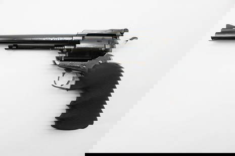 Ruger New Model Super Blackhawk Single Action Revolver: s.n. 81-16688, .44 Magnum, 7.5" barrel, adjustable rear sight, the grips replaced. In excellent condition with a faint drag ring on the cylinder. Includes a Hunter leather holster. Modern (25-0169)