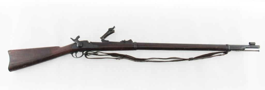 U.S. Springfield Model 1879 Trapdoor Rifle: s.n. 275143, .45-70, with 32.625" barrel. The breechblock marked "U.S. / MODEL / 1873" and markings of eagle and "U.S. / SPRINGFIELD" on the lock forward of the hammer. The stock stamped "A.J. PIKE" o