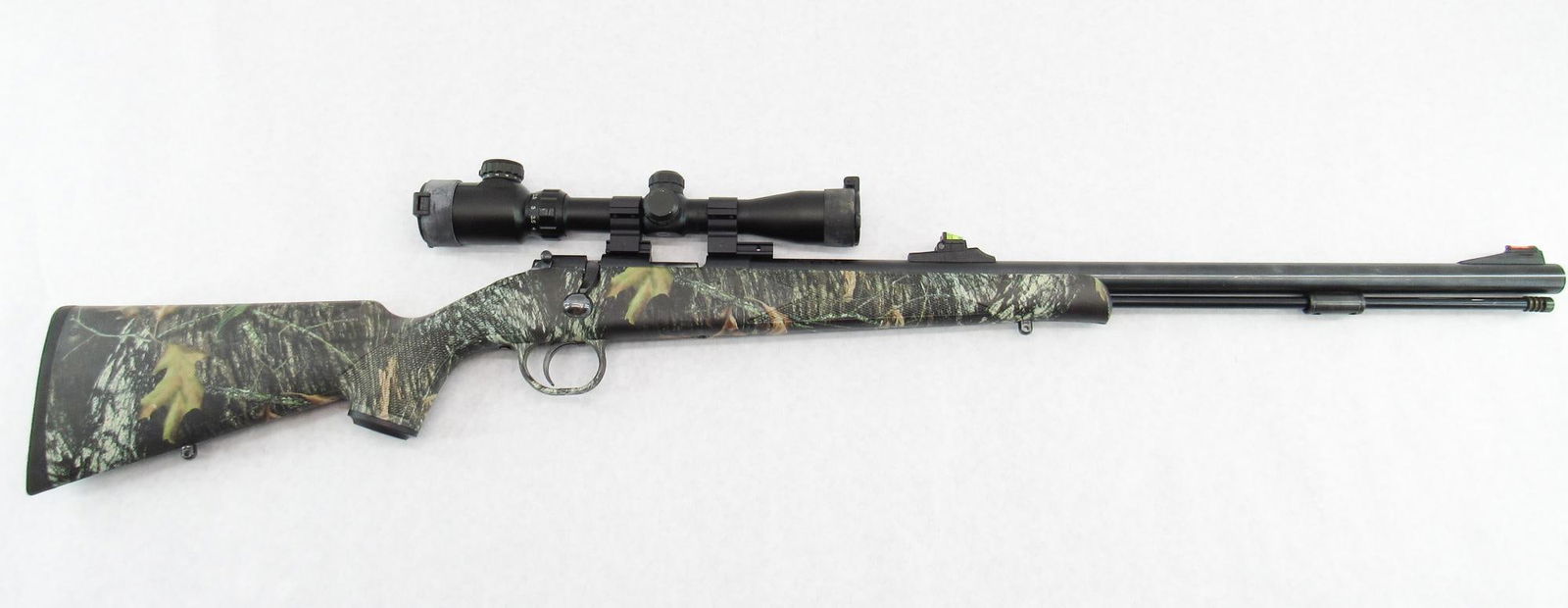 Traditions Evolution Inline Muzzleloading Rifle: s.n. 14-13-034588-03, .50 Cal., with 24.5" round barrel, camo synthetic stock and turgor 1.5-6X scope. Overall very good condition with spots of wear on the barrel. Exempt