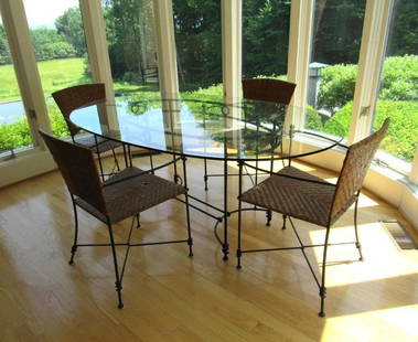 Roche Bobois Wrought Iron Dining Table & Chair Set: 70" x 43" x 29" 1/2" thick glass topped table; w/ (4) caned seat &amp; back arm chairs; some damage to caning; w/ bronze finials