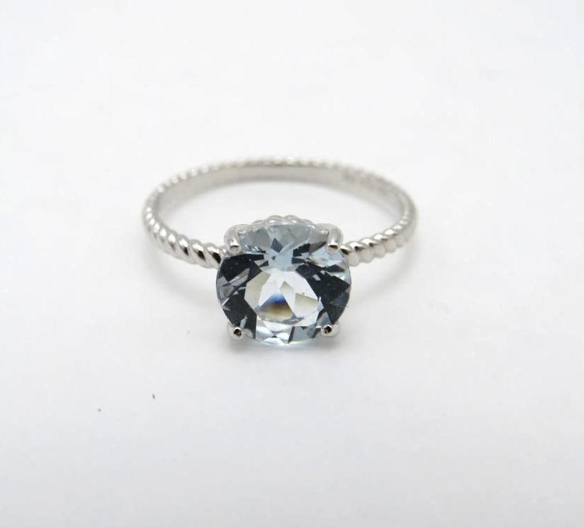 10K White Gold and Aquamarine Ring: 8mm round cut aquamarine, size 6, 1.31 grams total weight