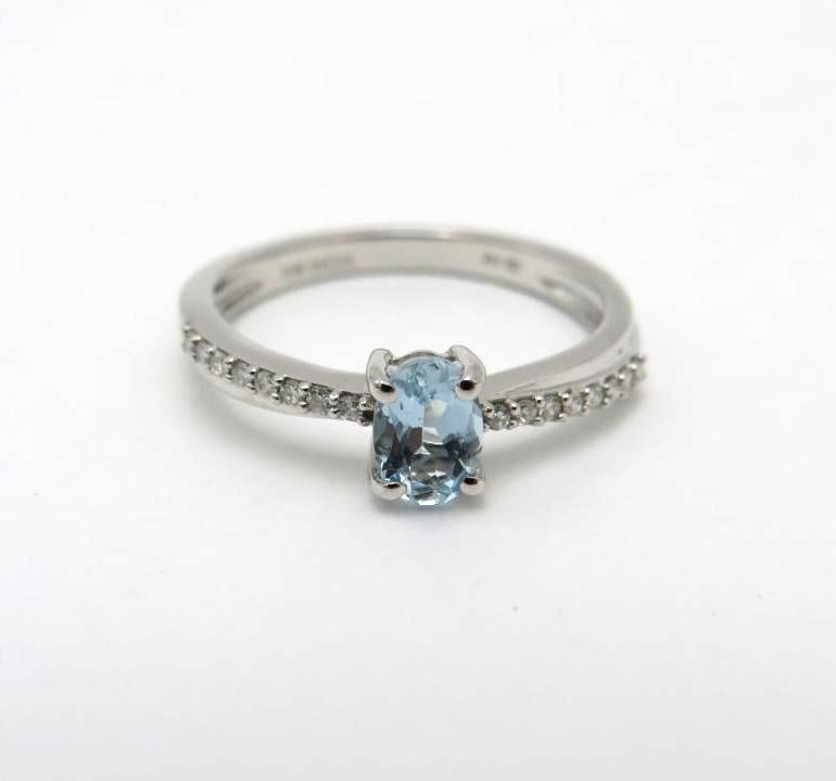 10K White Gold and Aquamarine Ring: 6mm x 4mm oval cut aquamarine with (16) 1mm +/- white sapphires on the shoulders, size 6, 2.1 grams total weight