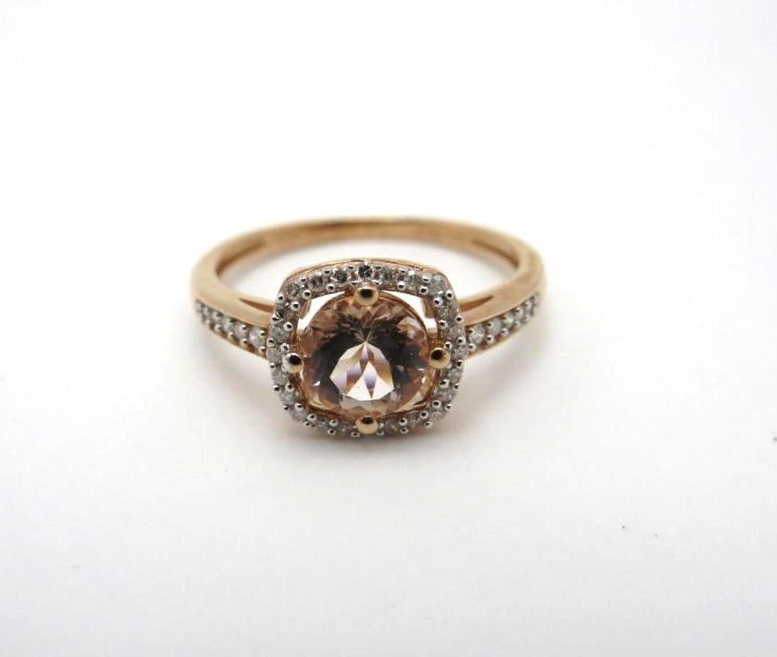 10K Rose Gold and Tourmaline Ring: 6mm round cut tourmaline with (34) 1mm +/- white sapphires surrounding and on the shoulders, size 6, 1.95 grams total weight