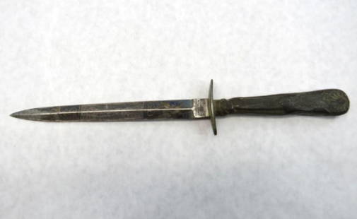 Civil War Tillotson & Co. Silver Handled Dagger: blued and gold blade with an eagle with "American" banner in its talons flanked by "The home of The Free" and "The Land of The Brave", repaired at the hilt, 10.875" in length, with remnants of the sca