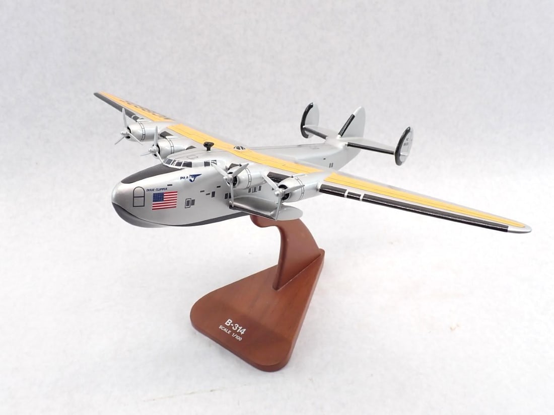 Carved Wood Pan Am B-314 "Dixie Clipper" Airplane: with stand, 18" wing span, some paint cracking due to wood shrinkage