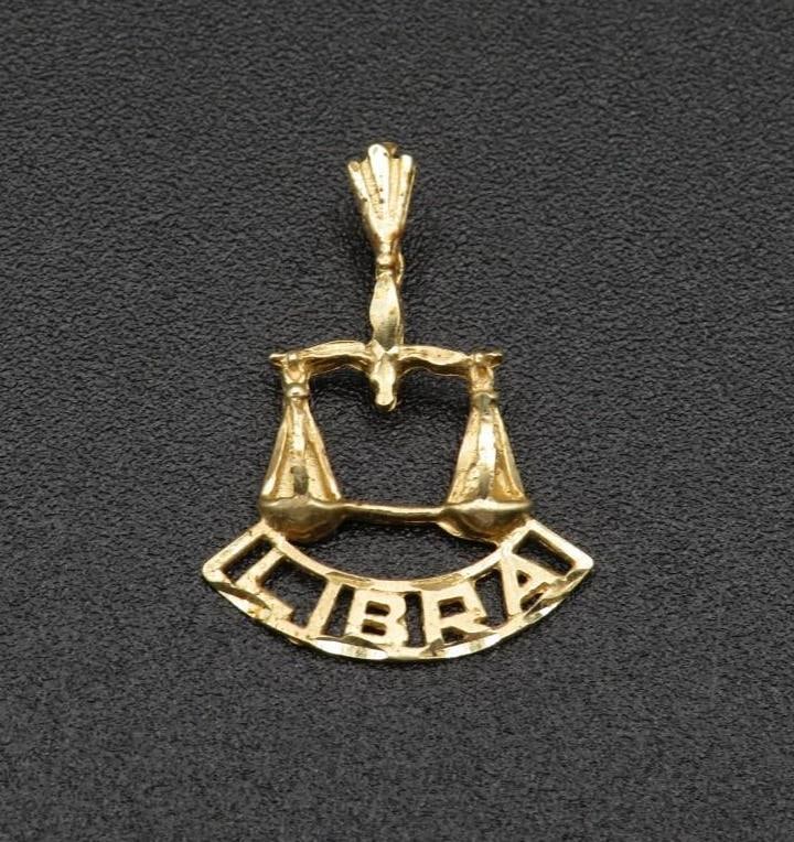 14K Yellow Gold Libra Pendant: 25mm in length, 1.13 grams
