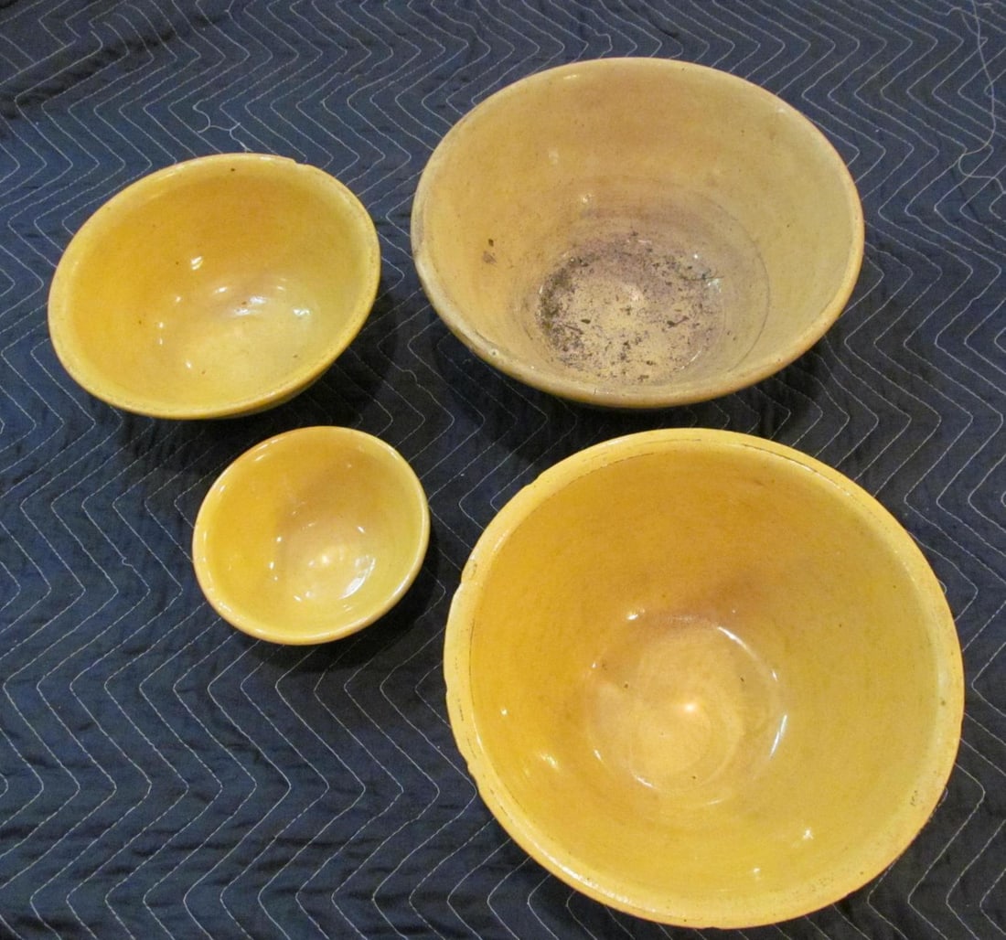 (4) Yellow Ware Mixing Bowls: *some chips on middle ones, some dirt on largest, hairline in smallest