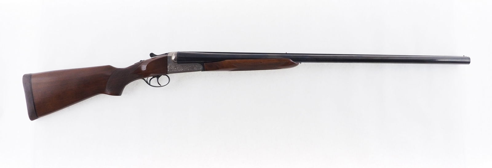 Kassnar Churchill Windsor I Side by Side Shotgun: s.n. 364994, 10 Ga., 32" solid rib barrels,3.5" chamber, choked mod. and imp. cylinder, double triggers. Engraved receiver. Gun is in very nice condition with bright shiny bores. Modern (26-0013)