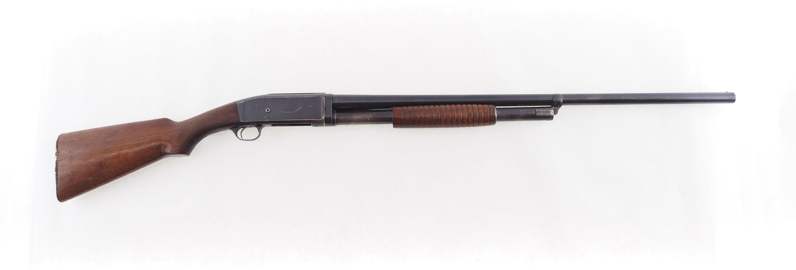 Remington Model 10-A Slide Action Shotgun: s.n. U173183, 12 Ga. 30" plain barrel, full chjoke, recoil pad is missing. Slight crack in butt stock where it meets receiver. C&R (26-0010) 