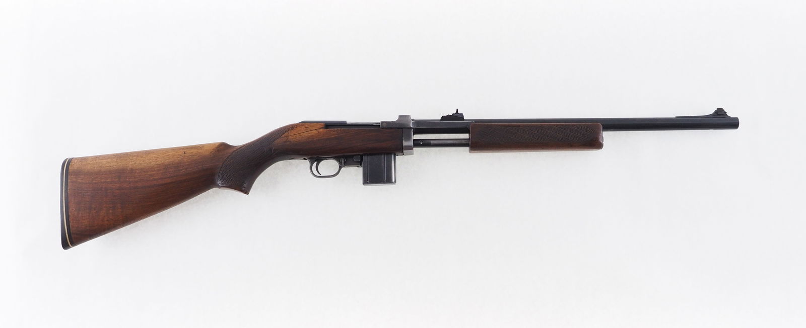 Universal Vulcan Slide Action Rifle: s.n. 1037, .44 Rem., 18" barrel. Butt stock has a few small cracks and has been checkered. This unusual little gun was based on the M1 carbine and produced from 1963 to 1967 with approx. 1500 being