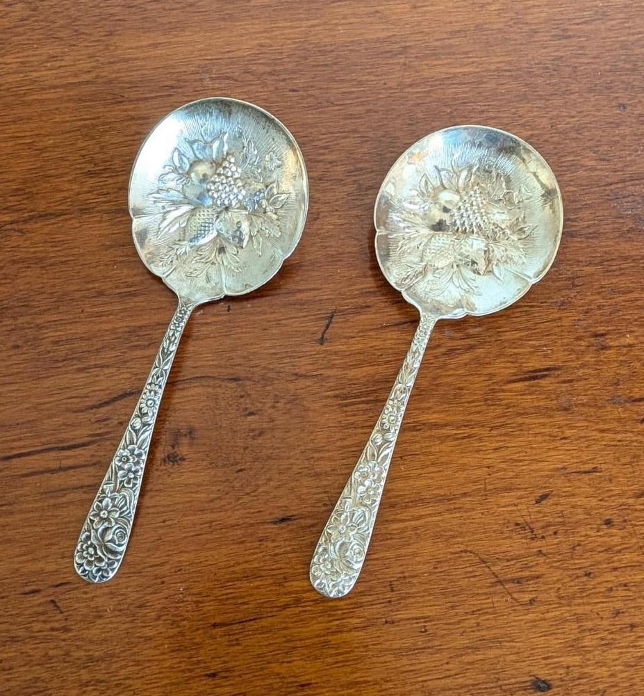 Pair of S. Kirk & Son Sterling Silver Repousse Berry Spoons: 5.125" & 5.25" in length; 56.7 grams; (1) monogrammed 