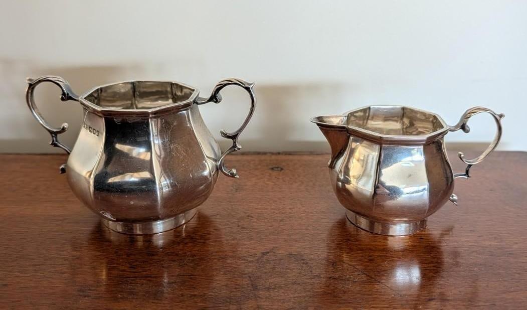 Lionel Alfred Crichton, London, Sterling Silver Sugar & Creamer: 3.125" & 2.625" in height; 332.8 grams; the sugar having a small dent 