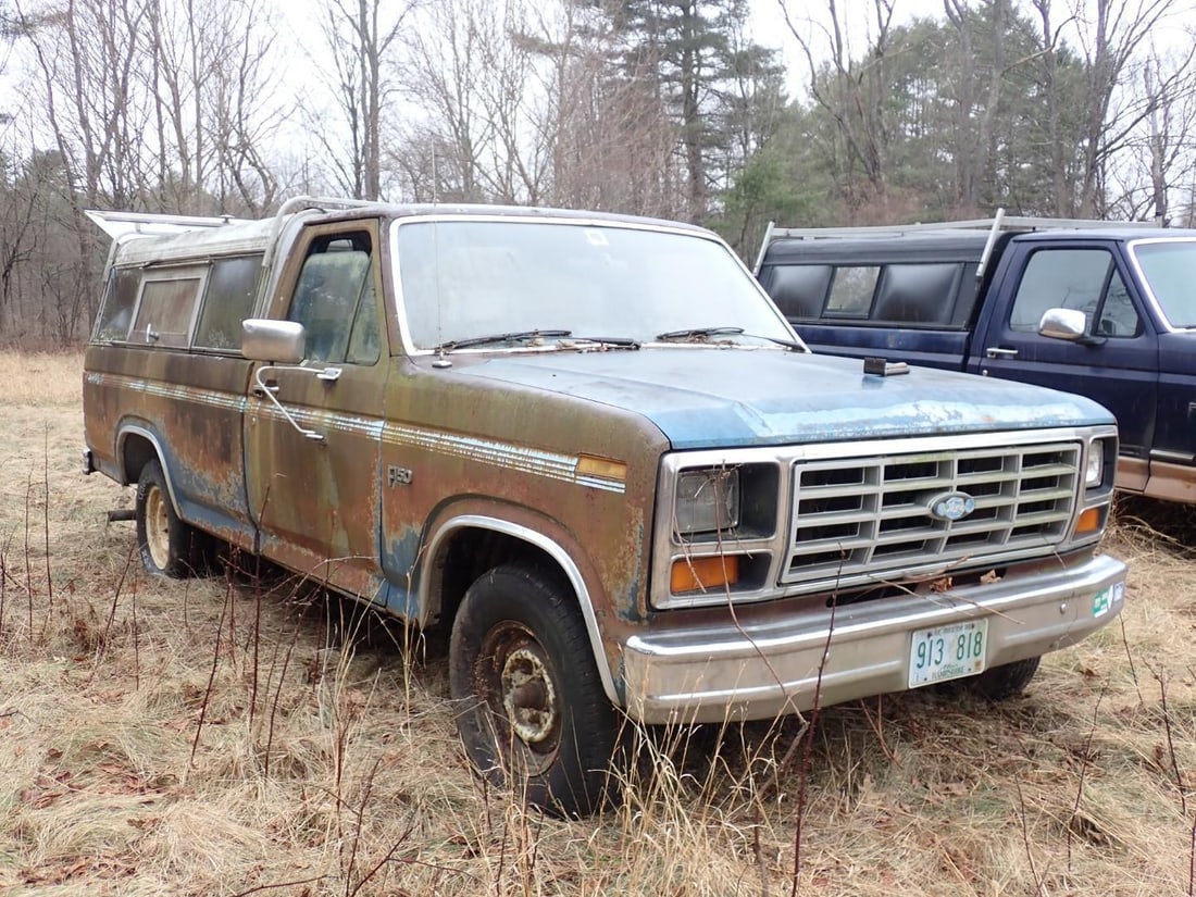 (2) Ford F150: 1984, 2FTDF13Y7ECA22596, TMU, 4 Spd Standard, DNR, **for parts only**, & 4x4 F150 w/ plow frame **as found**, Location: Backyard 