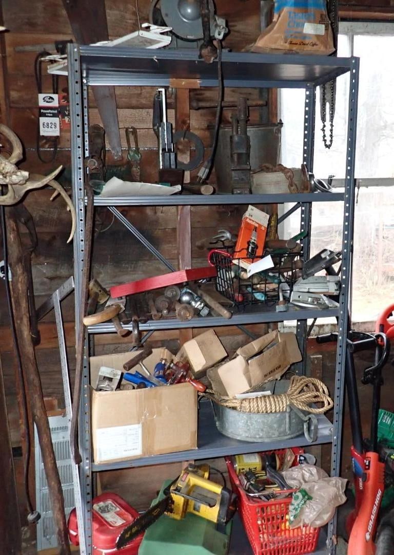 Contents of Metal Shelf: incl. Pry Bars, floor stablers, double end grinders, garden tools & ect., includes metal shelf, Location: House Addition 