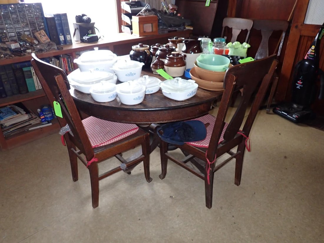 Oak Pedestal Base Dining Table & (4) Chairs: (1) leaf; 45" x 58" (w/ leaf) x 30"; chairs are upholstered leather seat; 18" x 18" x 38" 