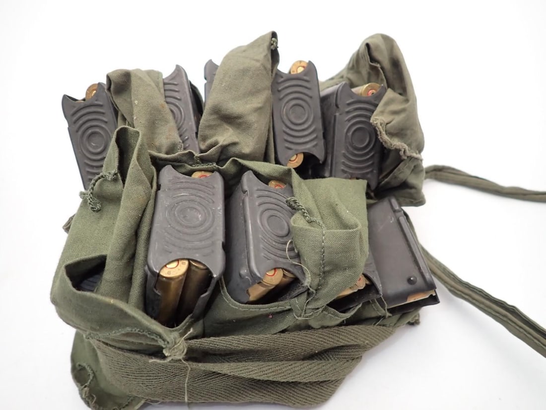 (56+/-) .30 Cal. Cartridges, (24+/-) .30 Cal Brass, (2) Bandoliers - 4
