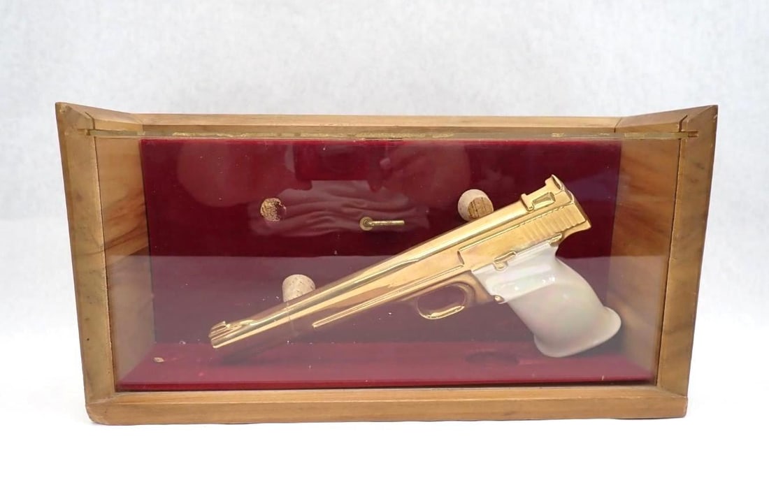 Ceramic Pistol Model in Case: pistol approx. 10" in length; slide repaired; case locked and no key